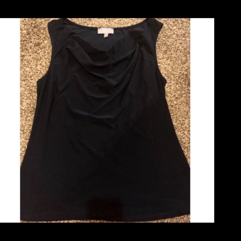 Sleeveless drape neck top.